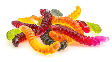Assorted vibrant gummy worms, isolated on white.の素材