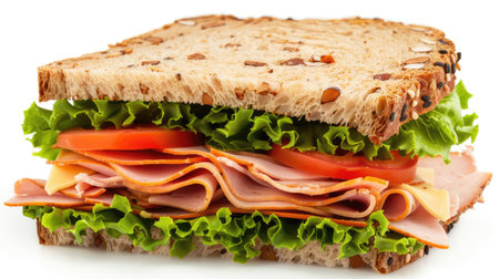 Isolated image of a deli sandwich with layers of ham, turkey, cheese, lettuce, and tomatoの素材