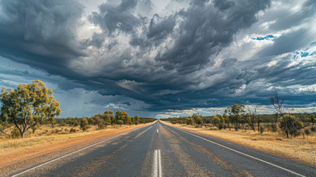 Endless Matilda Highway beneath the dramatic cloudy sky in Queenslandの素材