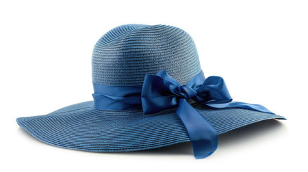 Beautiful blue vintage straw hat with wide brim and ribbon, isolated on white backgroundの素材