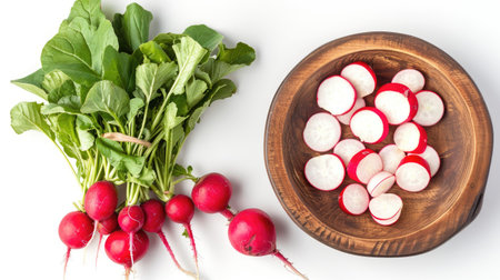 Fresh radishes and sliced radishes in a wooden bowl, isolated on white, top viewの素材