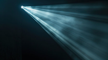 Single beam of light glowing on a dark black backdrop, close-upの素材
