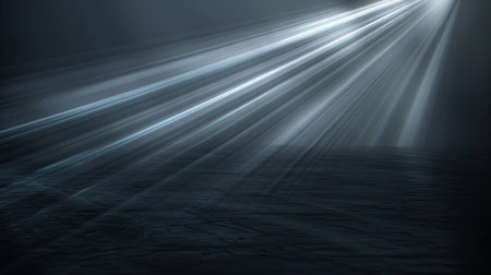 Radiant light beam glowing on a black backdrop, close-up viewの素材