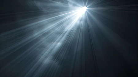 Radiant light beam glowing on a pitch-black backdrop, close-up viewの素材