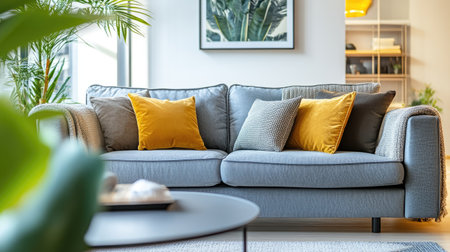 Beautifully styled living room with a gray sofa, no people, and selective focus on the decor. Perfect for showcasing home interiors.の素材