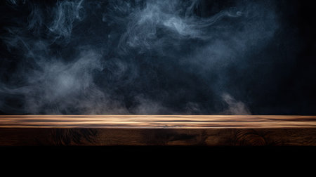 Wooden table and smoke on a black background, creating a mysterious scene with ample copy space for your message.の素材