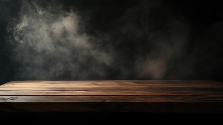 Wooden table and wisps of smoke rising on a black background, with plenty of copy space for text. Dark and atmospheric.の素材