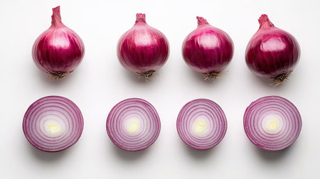 Flat lay of whole fresh red onion and its sliced halves on a white background, highlighting its rich red layersの素材