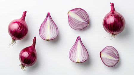 Isolated flat lay of fresh red onion, showing whole and sliced halves on a white background, emphasizing its rich red hueの素材