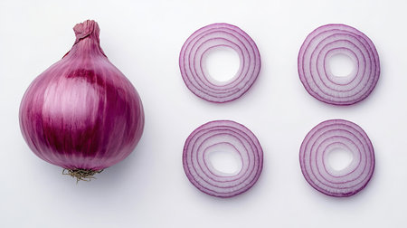 Flat lay of fresh red onion, sliced in half and rings, isolated on a white background, perfect for food styling and presentationの素材