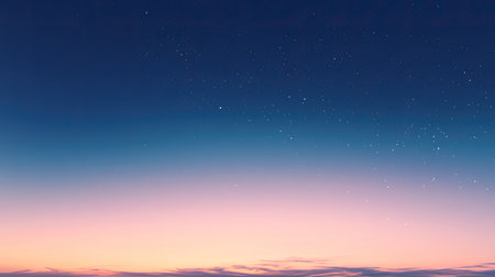 A clear sky at dusk with the first stars appearing, creating a soft gradient from blue to orange as day turns to night.の素材