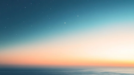 A serene dusk sky with the first stars appearing, a soft gradient from blue to orange fading into night.の素材