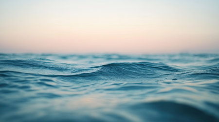 A blurred image of the ocean with soft waves and a distant horizon, creating a peaceful and calming background.の素材