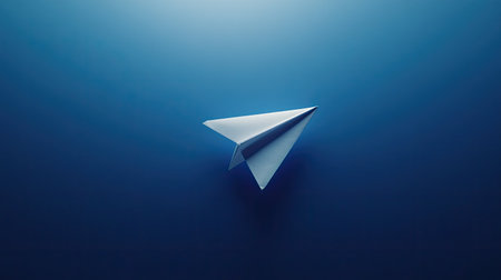 Blue background with a single white paper plane, centered and softly litの素材