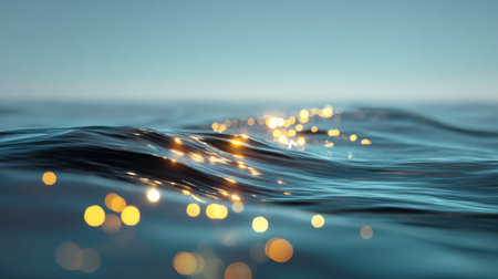 This enchanting image features calm ocean waves with sparkling bokeh effects under a soft blue sky, creating a serene atmosphere perfect for relaxation and meditation.の素材