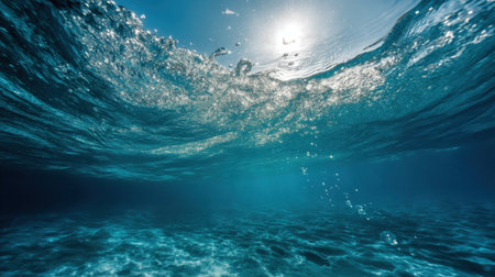 Captivating underwater view showcasing vibrant ocean waves and sunlight streaming through the water, creating a serene and tranquil seascape that inspires calmness.の素材