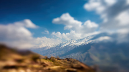 Explore a stunning mountain landscape showcasing snow-capped peaks against a brilliant blue sky. Experience the tranquility and beauty of nature in this serene wilderness.の素材