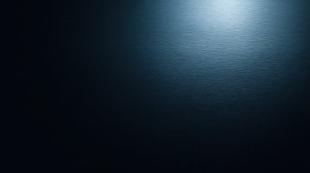 A striking abstract image featuring a dark blue background, smooth texture, and gentle light reflection, perfect for enhancing designs or creating a calming atmosphere.の素材