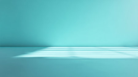 A serene interior space featuring a turquoise wall, soft light shadows, and a clean floor. Perfect for creative projects, designs, or calming atmospheres.の素材