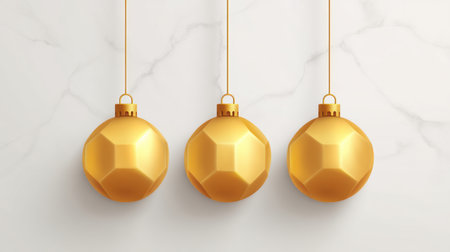Three golden ornaments hang gracefully on a smooth marble surface, creating an elegant setting perfect for Christmas, winter celebrations, and festive decorations.の素材