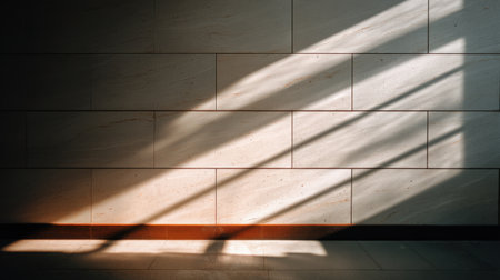Captivating interplay of soft light and shadows on a minimalist wall creates a tranquil ambiance, ideal for modern interior design and decor inspiration.の素材