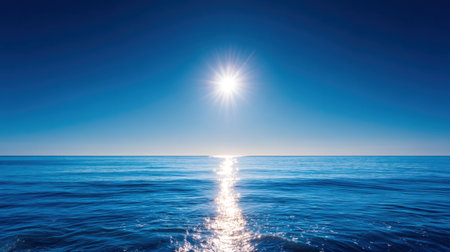 A breathtaking ocean view showcases bright sunlight reflecting on calm waters beneath a clear blue sky, evoking feelings of peace and tranquility perfect for relaxation.の素材