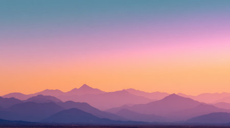 A breathtaking view of a sunset over mountains showcases a smooth blend of soft colors in the sky, creating a tranquil atmosphere perfect for relaxation and inspiration.の素材