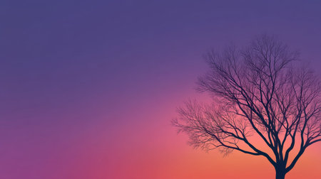 A stunning silhouette of a tree against a colorful sunset with hues of purple and orange, evoking feelings of peace and natural beauty in every viewer.の素材