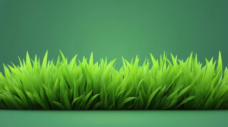 A close-up view of vibrant green grass blades against a smooth background, capturing the essence of nature's beauty, perfect for various design needs.の素材