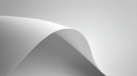 This image showcases a beautifully curved white paper surface, with soft shadows and a smooth texture, perfect for backgrounds in minimalist and artistic designs.の素材