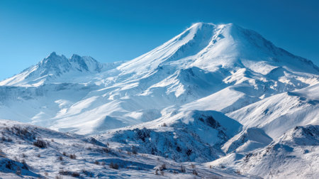 Breathtaking view of snow-capped mountains creates a stunning winter landscape. Clear blue skies enhance the beauty of the rugged peaks and tranquil valleys.の素材