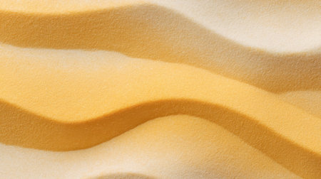 Explore the delicate curves and warm tones of soft yellow sand, capturing the beauty of nature's patterns and the interplay of light and shadow in an abstract style.の素材