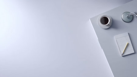 A serene and minimalistic workspace showcasing a cup of coffee, a notepad, and a pen on a clean desk, ideal for promoting productivity and inspiration in a modern setting.の素材