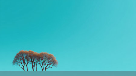 A captivating image showcasing bare trees set against a bright turquoise sky, embodying minimalism and tranquility, perfect for nature enthusiasts and art lovers.の素材