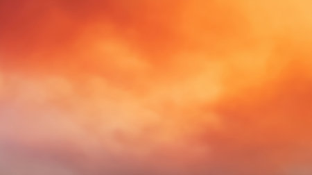 This stunning image captures the serene beauty of a sunrise sky filled with soft orange and yellow hues, evoking feelings of tranquility and inspiration.の素材