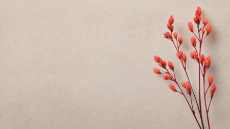 A beautiful arrangement of delicate red buds on slender stems showcases natural beauty against a soft, neutral background, ideal for artistic projects and decor.の素材