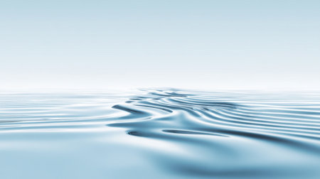 A serene water surface with gentle ripples and a soft blue hue creates a peaceful and calming atmosphere, perfect for backgrounds or design projects.の素材