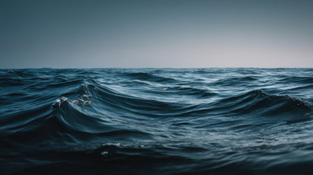 A captivating view of ocean waves gently rolling under a dusky sky, showcasing a serene seascape that evokes feelings of peace and tranquility in nature.の素材