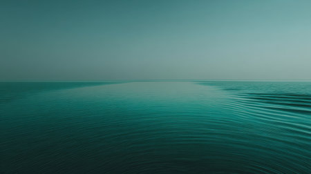 Experience the tranquility of the ocean in this serene photograph showcasing gentle ripples and a peaceful horizon. Ideal for relaxation and calm settings.の素材