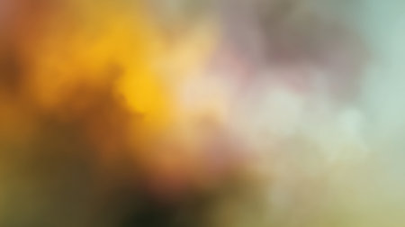 This soft abstract background features warm shades of yellow, orange, and pink blending into subtle hues of green and blue, creating an ethereal and tranquil atmosphere.の素材