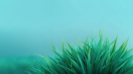 A serene close-up of lush green grass set against a calming blue background, evoking feelings of tranquility and natural beauty, perfect for relaxation themes.の素材