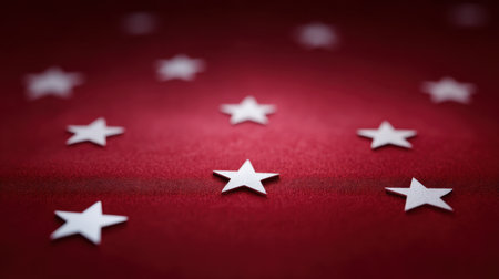 A close-up view of white stars laid out on a vibrant red surface, creating a bold and cheerful design perfect for patriotic themes and festive celebrations.の素材