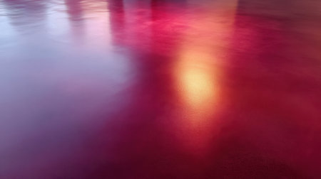 This abstract image features a colorful surface with shades of red, purple, and orange, reflecting light in a beautifully blurred and artistic manner, perfect for creative use.の素材