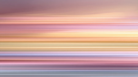 This abstract image features a soft gradient of warm and cool colors in a dynamic blur, creating a tranquil atmosphere ideal for modern decor and artistic projects.の素材