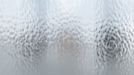 This image showcases a frosted glass texture that creates a soft focus background while offering an abstract reflection with visually intriguing distorted shapes.の素材