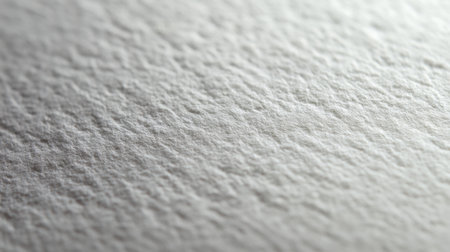 High-resolution close-up of white artist paper showcasing unique texture and subtle fiber patterns. Perfect for creative projects, backgrounds, and artistic expressions.の素材