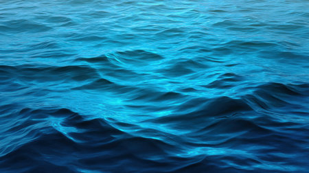 This vibrant image showcases serene blue ocean waves, reflecting light beautifully and embodying tranquility. Perfect for projects related to nature, relaxation, and marine environments.の素材
