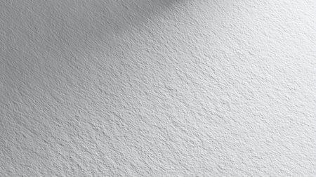 This image showcases a textured white surface with subtle shadows, creating an elegant and minimalist aesthetic. Perfect for backgrounds and design projects.の素材