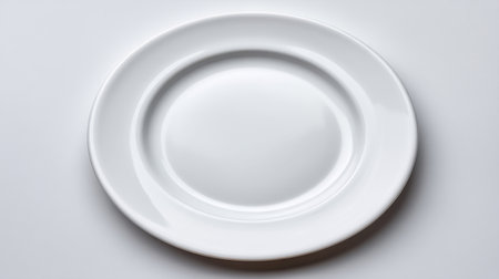 This image features a minimalistic white plate set on a soft background, highlighting its simplicity and elegance, ideal for food presentations and menu designs.の素材