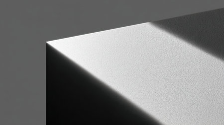 This image showcases a minimalist abstract composition featuring a textured wall with captivating shadows and light play that evokes tranquility and artistic inspiration.の素材